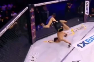 lutador-cai-de-cara-no-chao-ao-comemorar-vitoria-com-mortal;-video