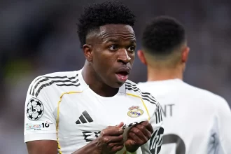 vini-jr.-marca-e-danca,-real-vence-benfica-e-vai-as-oitavas-da-champions